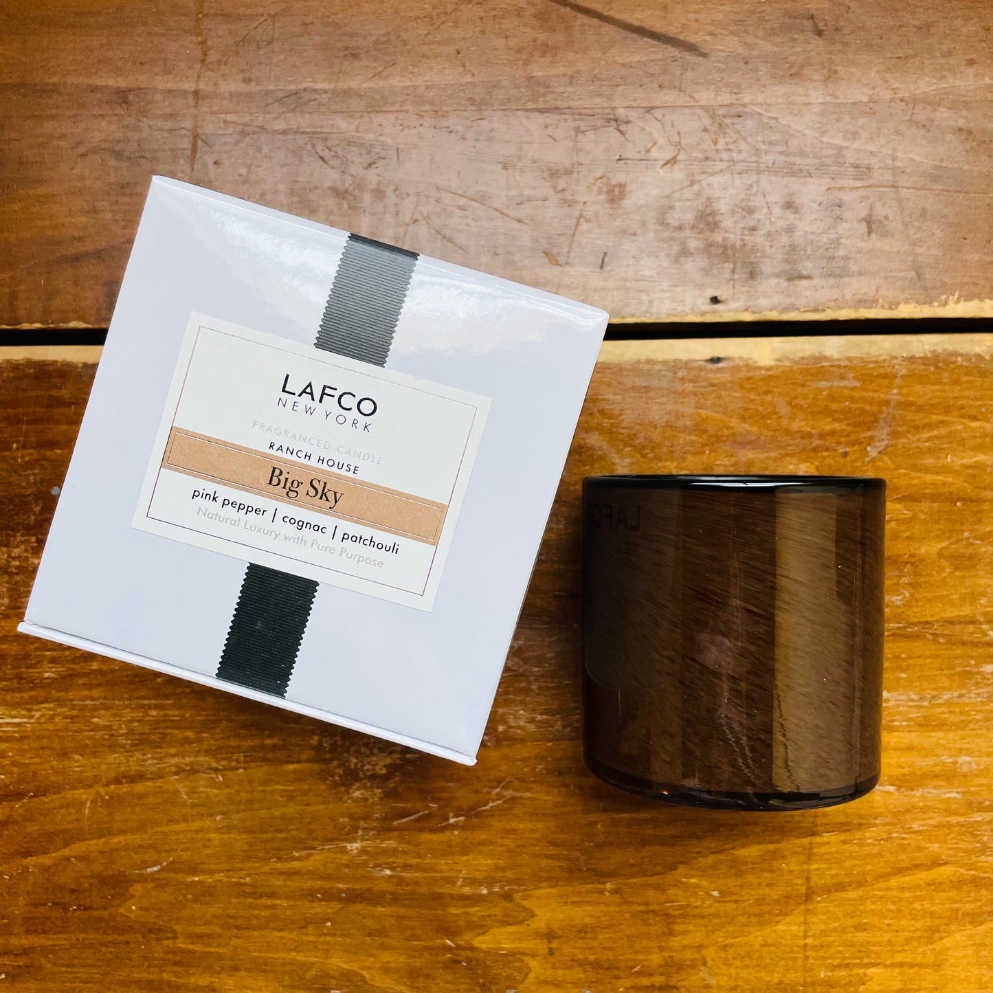 LAFCO Big Sky Candle with packaging, showcasing the candle in a dark brown cylindrical glass vessel.